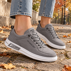 Sneakers donna grigie con lacci in tono e suola bianca a contrasto