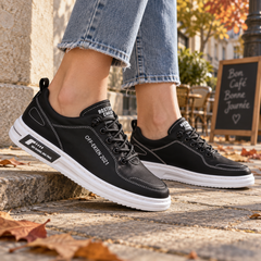 Sneakers donna nere con cuciture bianche a vista e suola bianca