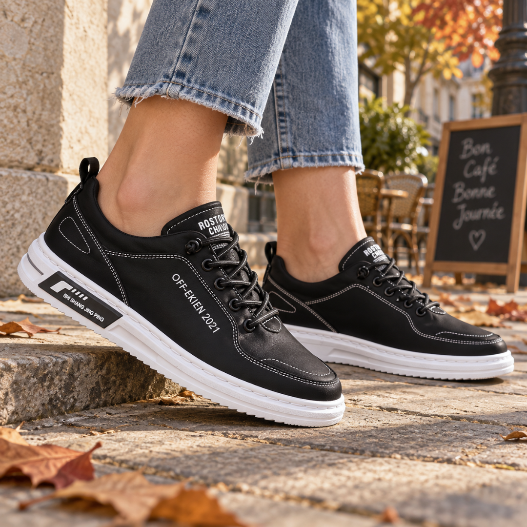 Sneakers donna nere con cuciture bianche a vista e suola bianca