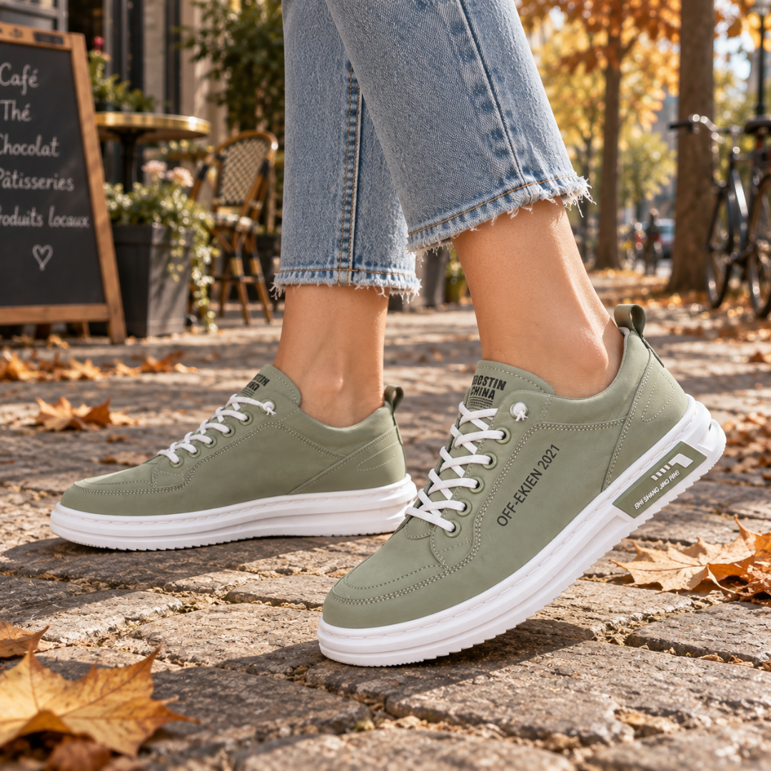 Sneakers donna verdi stringate con cuciture a vista sulla tomaia e suola bianca