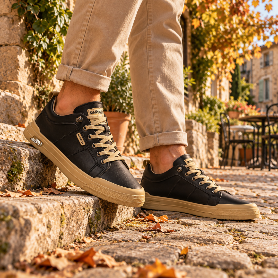 Sneakers uomo nere stringate su gradino, suola a contrasto e punta arrotondata