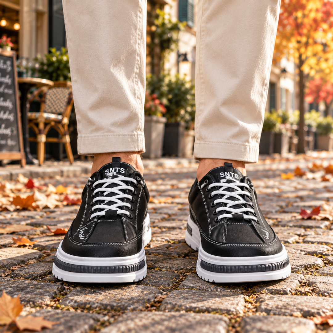 Sneakers uomo nere di fronte con lacci bianchi e suola chunky bianca