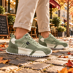 Sneakers uomo verdi di profilo con inserti in rete traforata ed etichetta laterale
