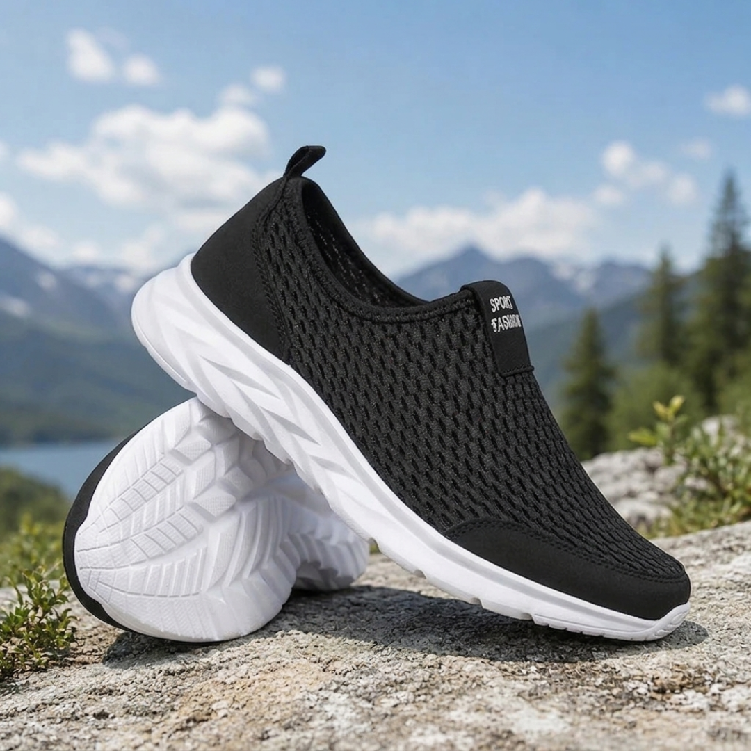 Sneakers uomo slip-on nere con suola bianca e linguetta posteriore, vista laterale