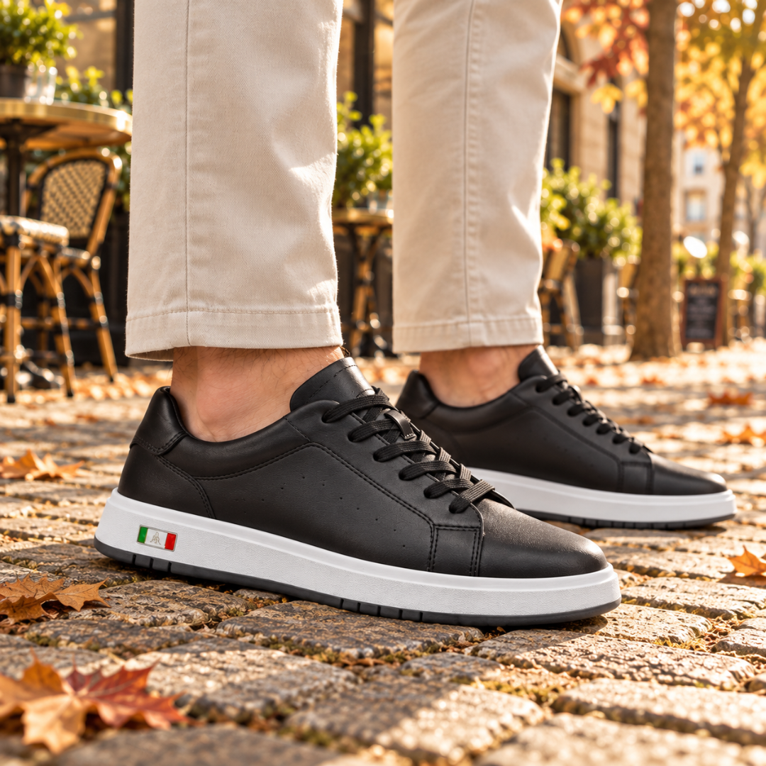 Sneakers uomo nere di lato con cuciture a vista e fori decorativi