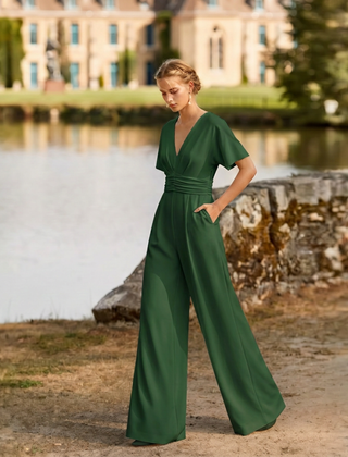 Tuta verde donna con scollo a V incrociato e tasche laterali nascoste