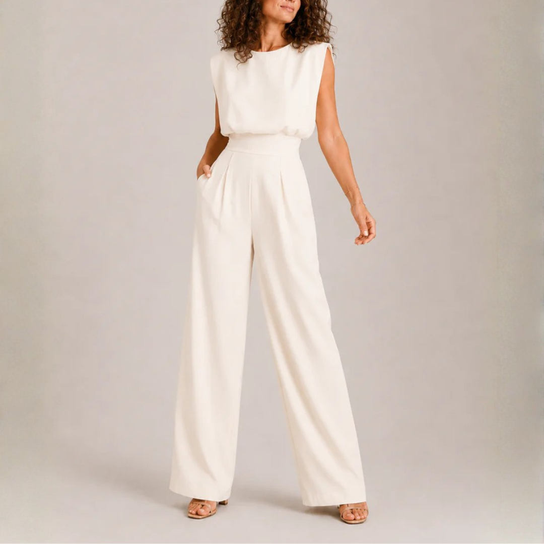 Tuta donna crema senza maniche con pantalone ampio e pieghe frontali