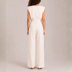 Retro della tuta crema con spalle strutturate e zip centrale