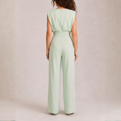 Retro della tuta verde menta con zip e fascia alta in vita