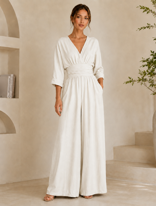 Tuta donna bianca lunga con scollo a V e pantalone a gamba larga