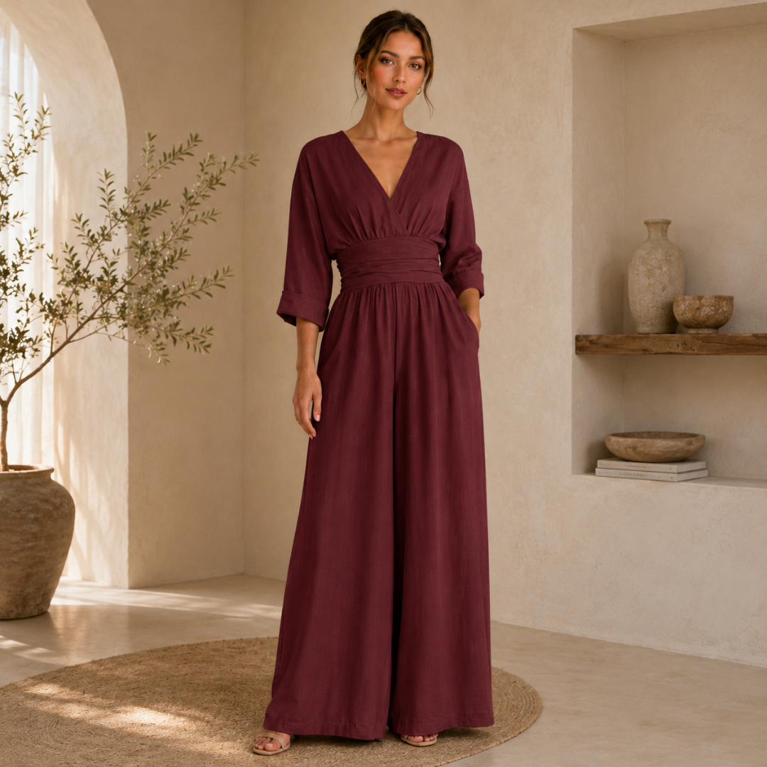 Tuta bordeaux lunga con corpetto incrociato e pantalone ampio dalla caduta morbida