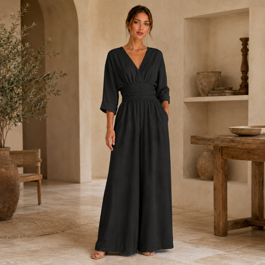 Tuta nera elegante con scollo a V, tasche laterali e gamba ampia