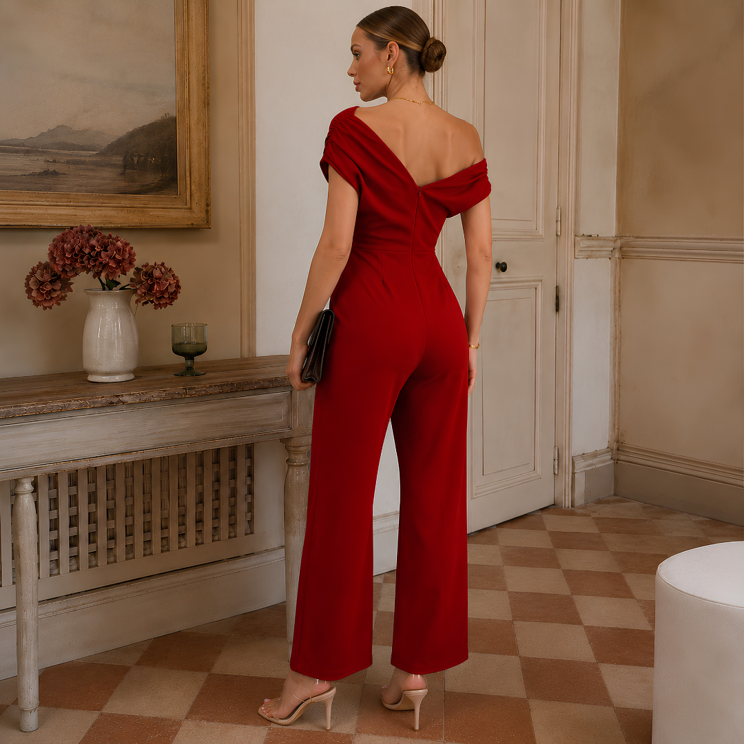 Retro della tuta donna rossa con scollo a V e zip centrale posteriore