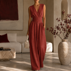 Tuta rossa donna senza maniche con fascia drappeggiata e pantaloni ampi