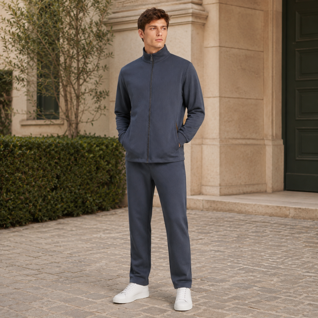 Completo grigio scuro due pezzi con zip integrale e pantaloni in tinta unita