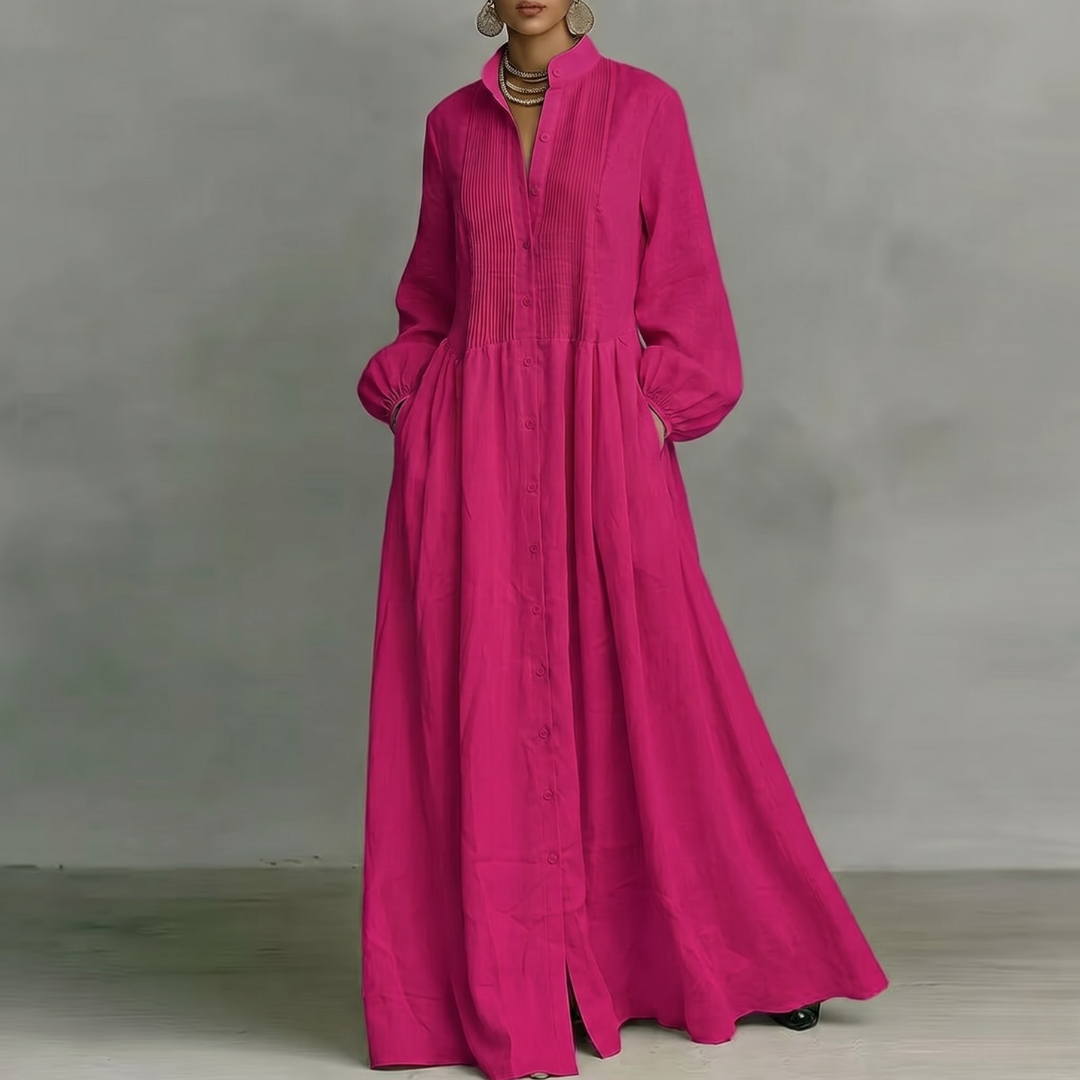 Vestito lungo fucsia con corpetto plissettato verticale e gonna molto ampia