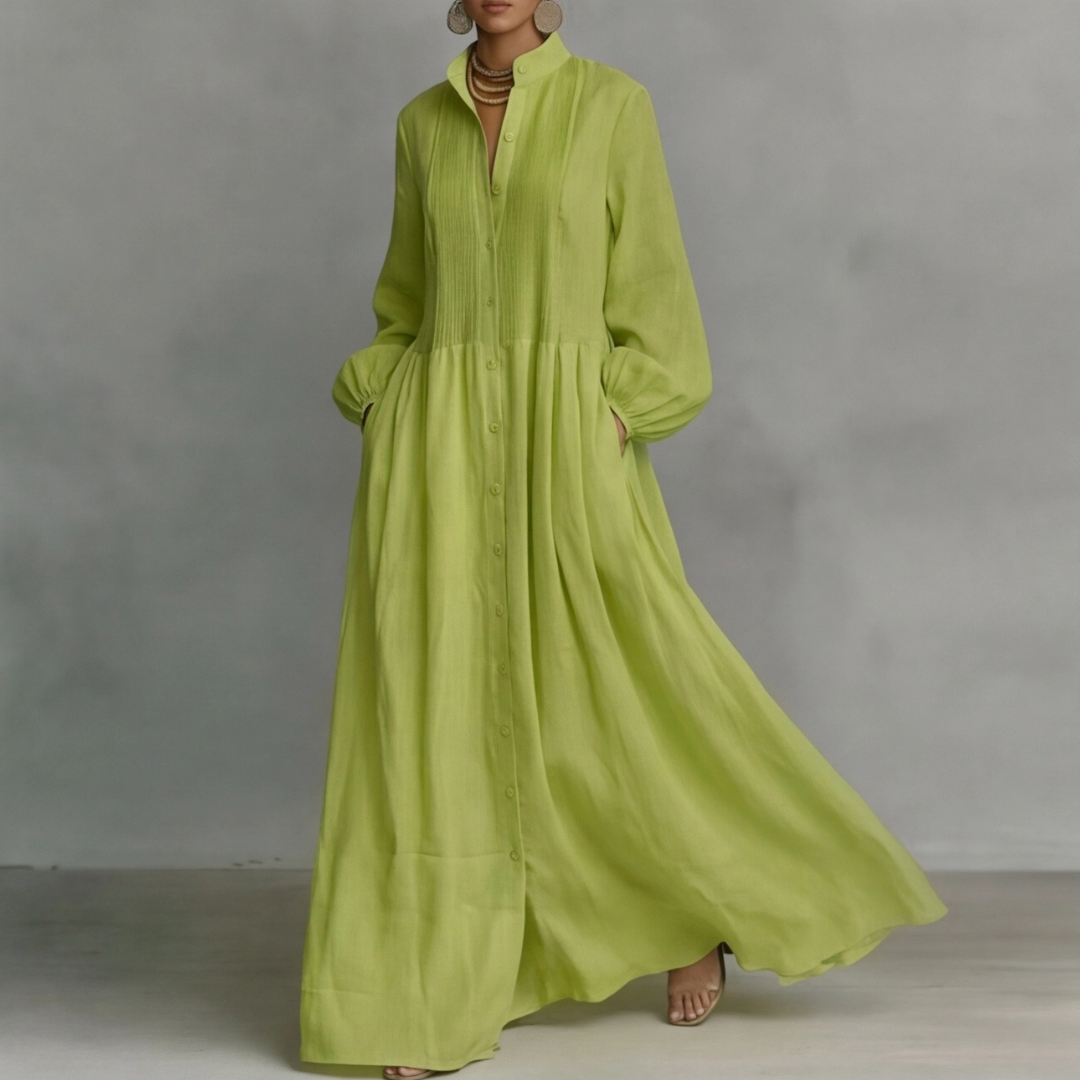 Vestito lungo verde chiaro in movimento con gonna svasata e tasche laterali