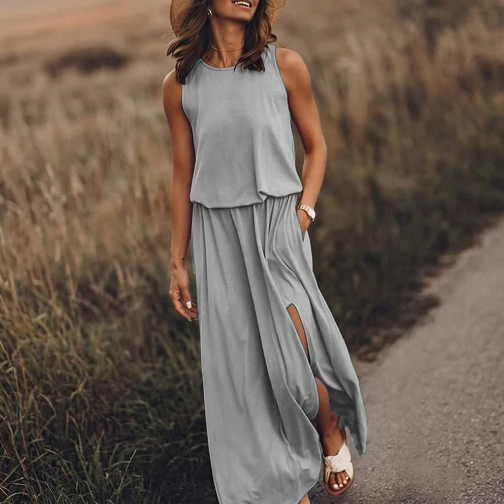 Vestito lungo grigio con girocollo arrotondato e gonna con spacco laterale