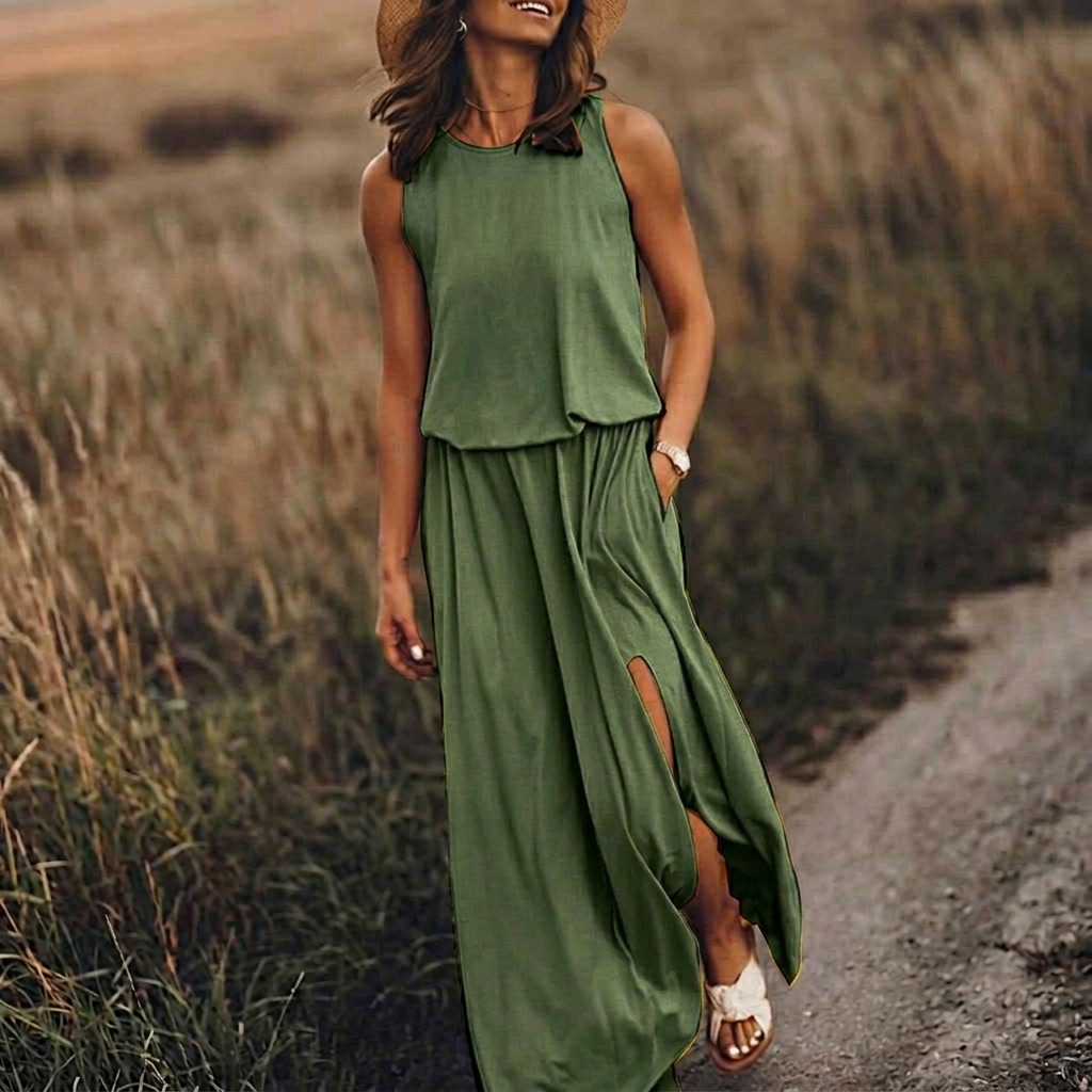 Vestito lungo verde senza maniche con vita arricciata e spacco laterale