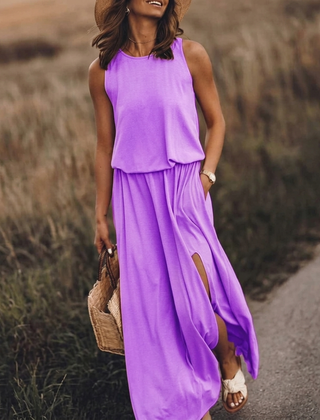Vestito lungo viola con corpino blusante, girocollo e spacco sulla gonna