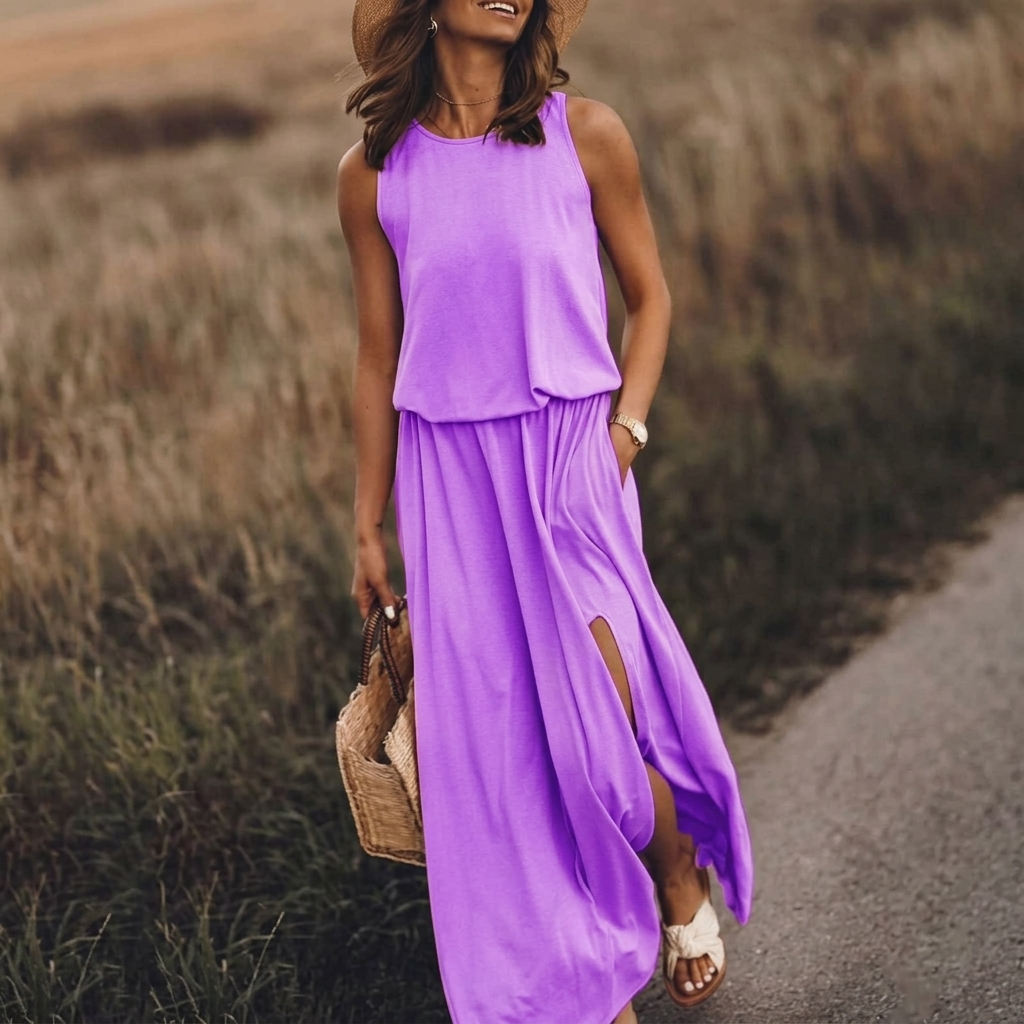 Vestito lungo viola con corpino blusante, girocollo e spacco sulla gonna