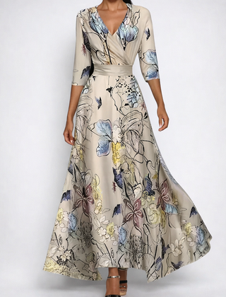 Vestito lungo beige con stampa floreale dipinta e scollo a V incrociato
