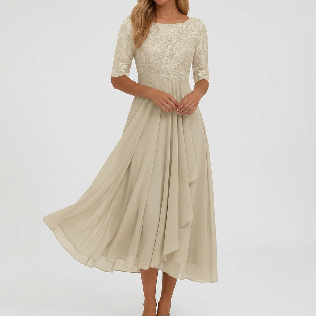 Vestito midi beige elegante con gonna ampia e orlo leggermente asimmetrico