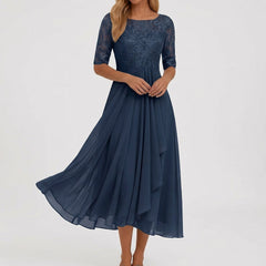 Vestito midi blu navy con corpetto ricamato e drappeggio verticale sulla gonna