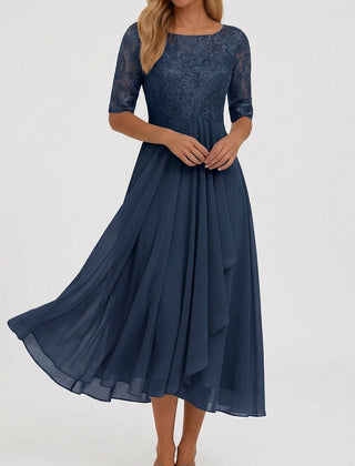 Vestito midi blu navy con corpetto ricamato e drappeggio verticale sulla gonna