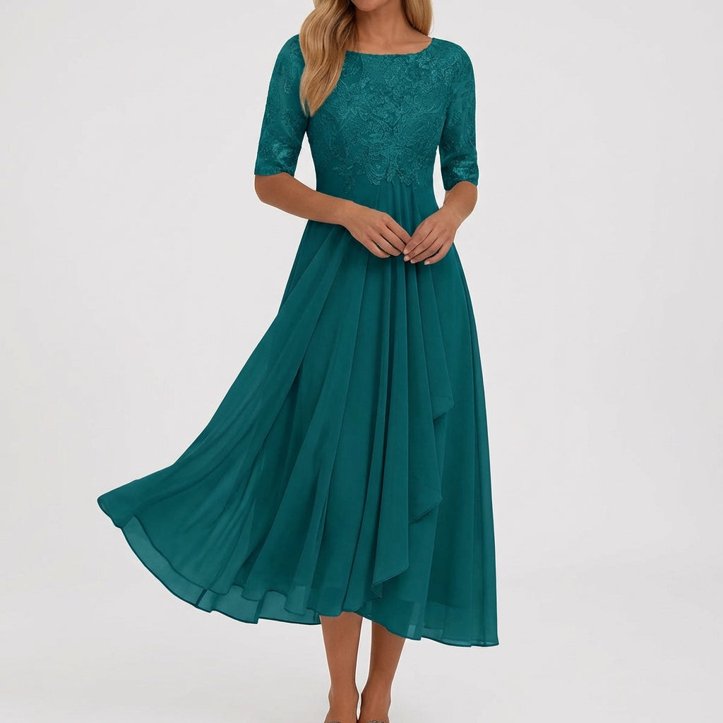 Vestito midi ottanio con mezze maniche traforate e gonna fluida svasata